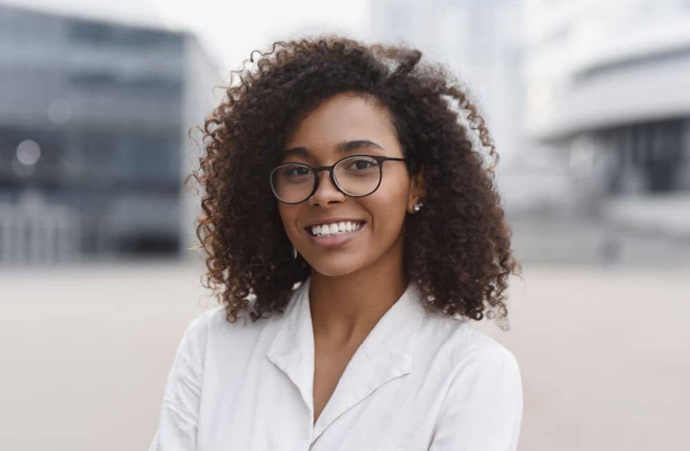 Multiracial curly hair girl wearing glass